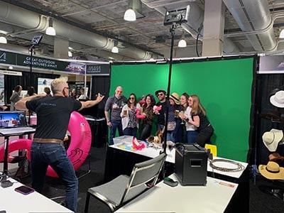 Photographer Mike Gatty poses participants at this Boston Green screen photography experience