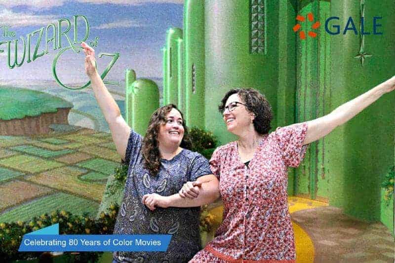 Two participants skip down the yellow brick road in this Boston Greenscreen Photo Booth