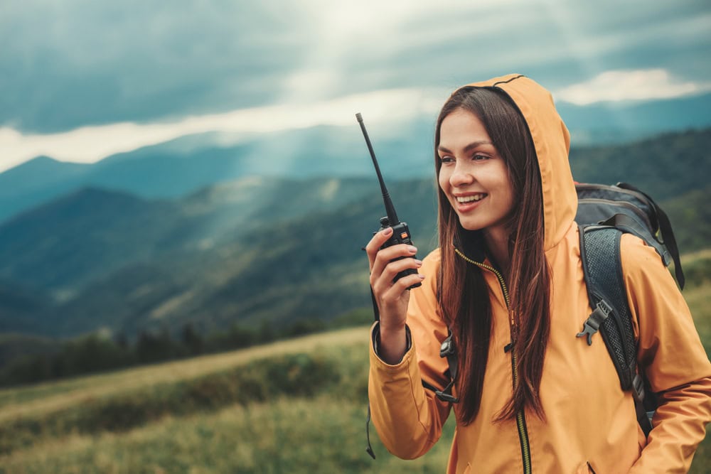Woman using forest service radio communication