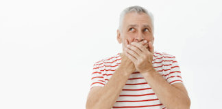 Shocked Senior Man Shut Mouth Concerned Looking Upper Left Corner (1)