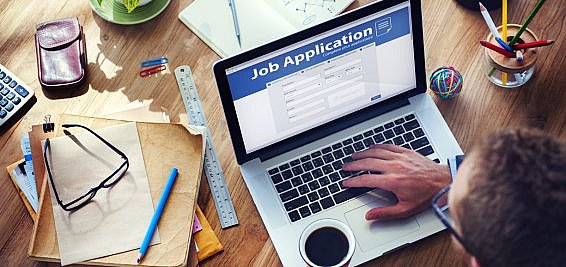 candidates looking at job adverts