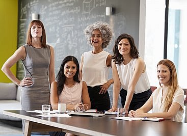women in consulting meeting to discuss client business