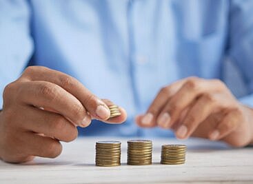 Management Consultancy Salaries 2023 - piles of coins