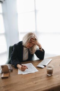 Woman at a desk reviewing a CV