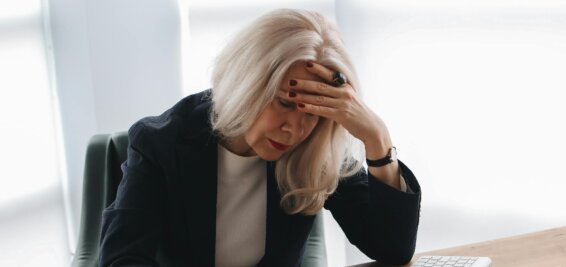 Woman at a desk reviewing a CV