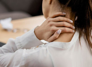 Young Woman Having Neckache While Working Home