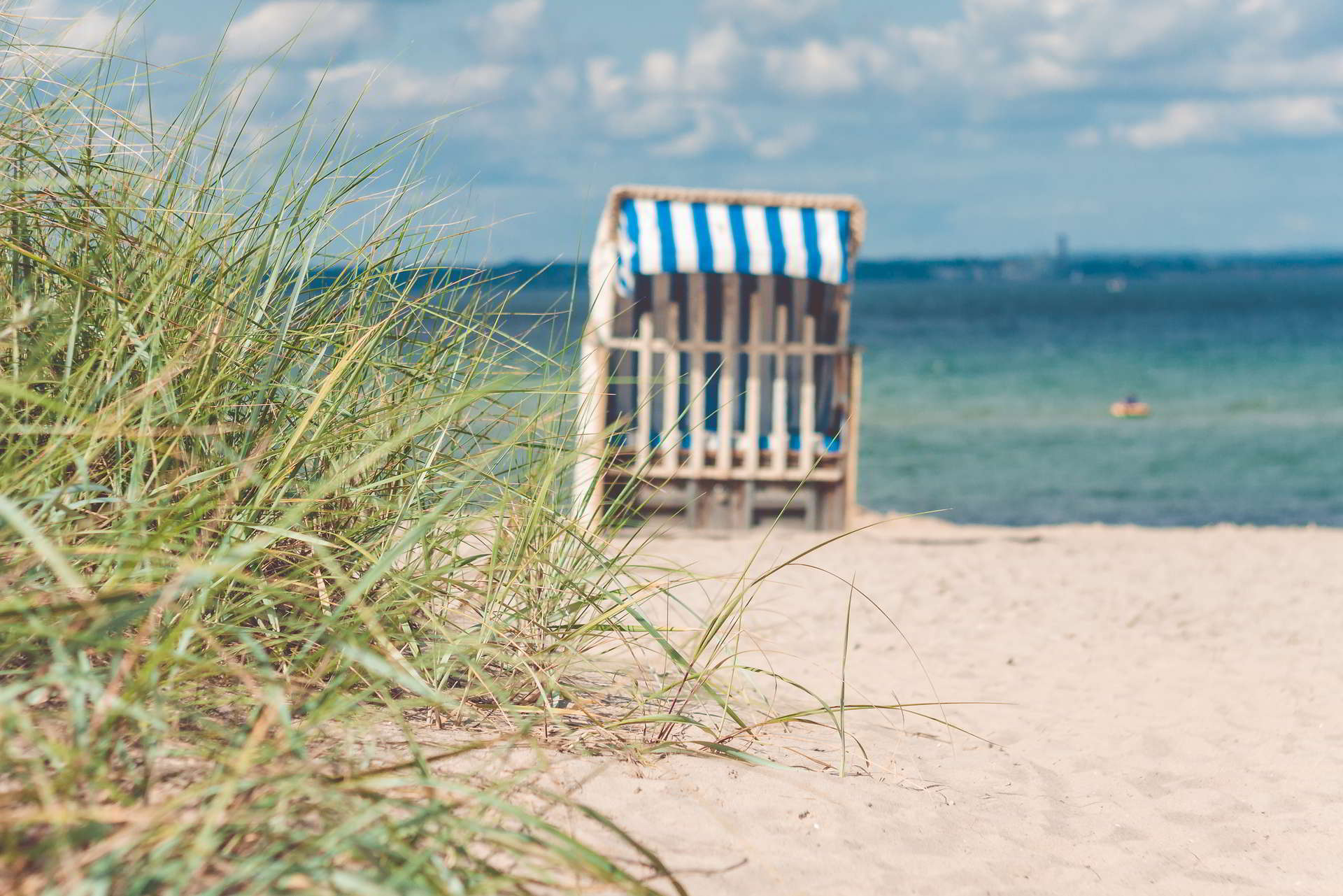 sandy beach traditional wooden beach chairs northern germany coast balti