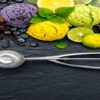 Dairy-Free Delights Creating Rich Homemade Vegan Ice Cream featured image 200x600w various scoops of differently coloured ice creams with an array of fresh ingredients used to make plus silver ice cream scoop frosted fusions