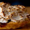Homemade Baked Alaska Its the Bomb featured image 200x600w baked alaska on wooden surface frosted fusions