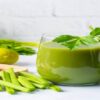 Revitalise And Refresh The Ultimate Detox Green Smoothie featured image 200x600w green smoothie in glass with several ingredients surrounding it including spinach leaves lime apple celery broccoli cucumber frosted fusions