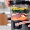 The-Ninja-Blast-Portable-Blender-A-Detailed-Review-featured-image-818x2600w-ninja-blast-portable-blender-loaded-with-ingredients-ready-to-be-blended-frosted-fusions