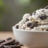 An-Irresistibly-Easy-Homemade-Oreo-Ice-Cream-Recipe-featured-image-white bowl of Oreo Ice Cream with Oreo cookies-frosted-fusions