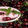 Homemade-Cherry-Ice-Cream-Recipes-featured-image-200x620w-cherry-ice-cream-with-fresh-cherries-scatted-around-and-an-ice-cream-scoop-frosted-fusions