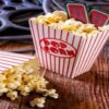 Transform-Movie-Nights-With-Delicious-Homemade-Popcorn-Ice-Cream-featured-image-207x620w-boxes-of-popcorn-with-cinema-tickets-and-movie-reels-frosted-fusions