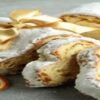 Stollen-Cake-Ice-Cream-Recipe-A-Taste-Of-Germany-featured-image-280x1000w-stollen-cake-sliced-with-festive-decor-frosted-fusions