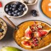 Frozen-Smoothie-Bowls-–-Easy-Flavourful-And-Full-Of-Goodness-featured-image-cropped-207x620w-top-view-of-different-smoothie-bowls-with-a-variety-of-fresh-ingredients-and-toppings-frosted-fusions