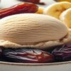 Homemade-Low-Fat-Date-And-Banana-Vegan-Ice-Cream-Recipe-featured-image-637x1920w-white-bowl-of-date-and-banana-ice-cream-with-fresh-dates-and-sliced-banana-Frosted-Fusions