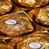Ferrero-Rocher-Lovers-This-Homemade-Ice-Cream-Recipe-Is-For-You-Featured-Image-637x1920w-close-up-of-tray-of-Ferrero-Rocher-in-gold-wrapping-Frosted-Fusions