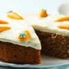 Homemade-Carrot-Cake-Ice-Cream-Recipe-featured-image-207x620w-carrot-cake-with-frosting-and-slice-cut-out-with-candied-carrots-Frosted-Fusions