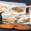 Homemade-Nougat-Ice-Cream-–-A-Classic-British-Treat-Reimagined-featured-image-207x620w-stack-of-nougat-with-almonds-nuts-wooden-background-Frosted-Fusions