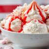 Homemade-Eton-Mess-Inspired-Ice-Cream-To-Celebrate-St-Georges-Day featured image 637x1920w bowl of Eton Mess Ice cream with fresh strawberries and coulis and St Georges Flag in the background Frosted-Fusions