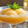 Mimosa-Sorbet-–-A-Brunch-Inspired-Frozen-Bubbly-Dessert-Featured-Image-637x1920w-glass-dessert-dish-of-mimosa-sorbet-with-oranges-and-blubbly-Frosted-Fusions
