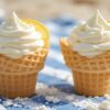 Lemon Meringue Ice Cream Zesty Creamy Completely Irresistible Featured image 637x1920w Gingham picnic blanket with two ice cream cones filled with Lemon meringue ice cream with fresh lemons and meringue Frosted Fusions
