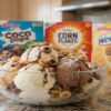 Cereal-ously-Delicious-Ice-Cream-Fusions-Inspired-By-Your-Favourite-Breakfasts-Featured-image-cereal-boxes with bowl of ice cream topped with cereal Frosted Fusions