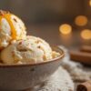Ice Cream & Mental Health – A Feel-Good Scoop For World Mental Health Day Image 4 honey cinnamon ice cream with caramel drizzle cosy autumn background with pumpkin and soft lights Frosted Fusions