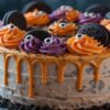 Scarily Easy Halloween Ice Cream Cakes Featured Image Full Halloween ice cream cake with orange and purple buttercream drips topped with Oreos and candy eyes pumpkins Frosted Fusions