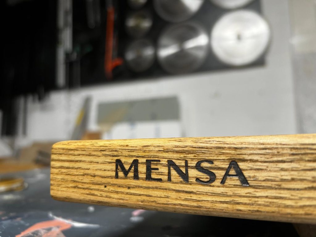 Solid Ash table top, finished in police oil and stamped with the the Mensa Table company brand