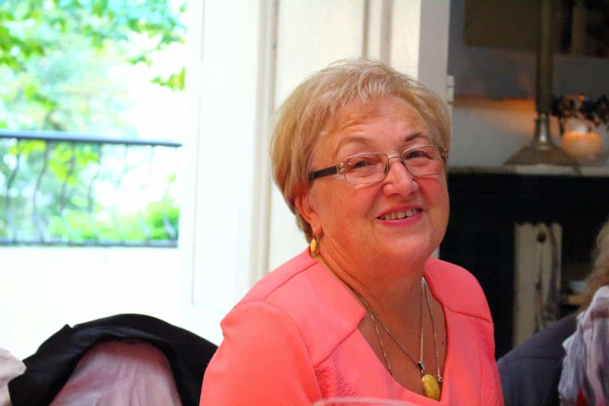 Old lady in a pink top.