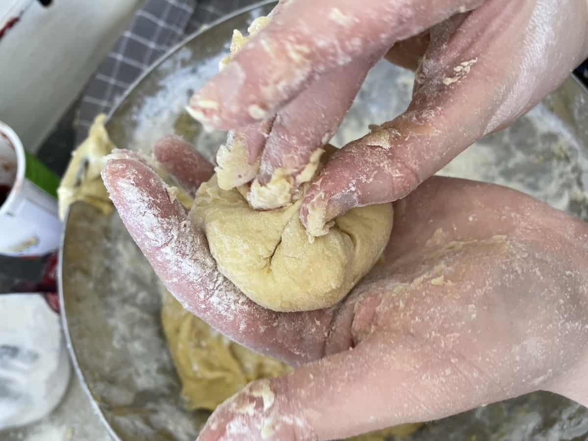 Sealing the doughnut dough.