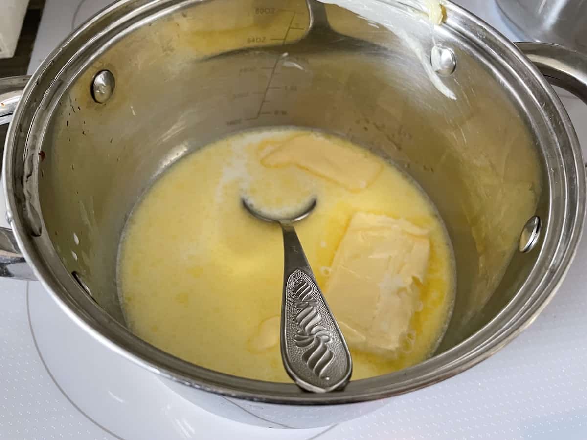 Butter and milk in a pot.