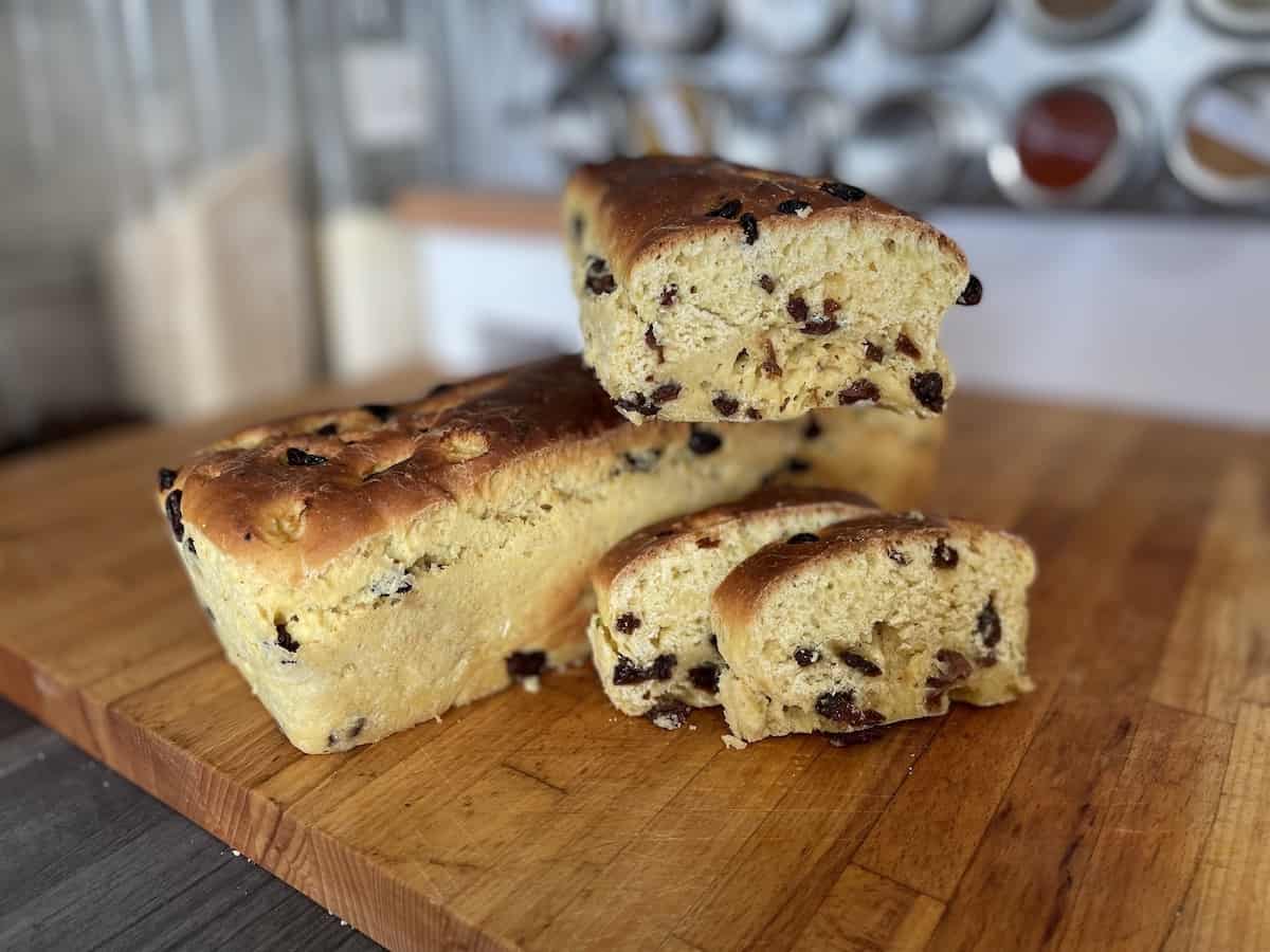 Bułka z rodzynkami or Polish raisin bread in a chopping board.