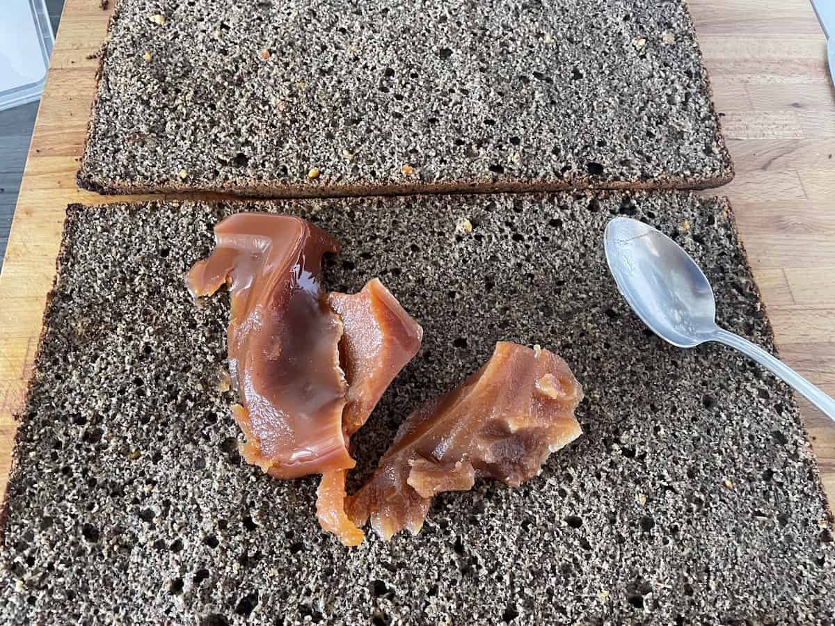 Cake cut horizontally in two pieces.