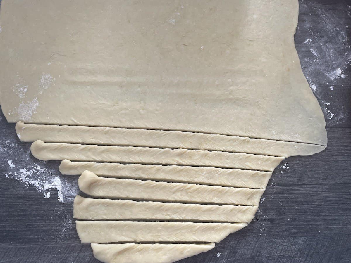 Cut the dough into 1 inch strips.