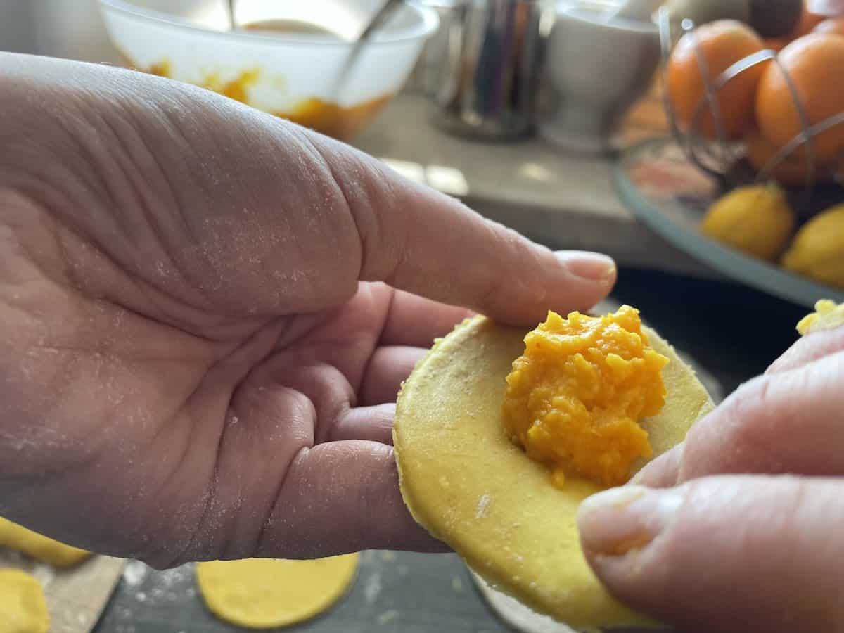 Add the filing into the pumpkin pierogi