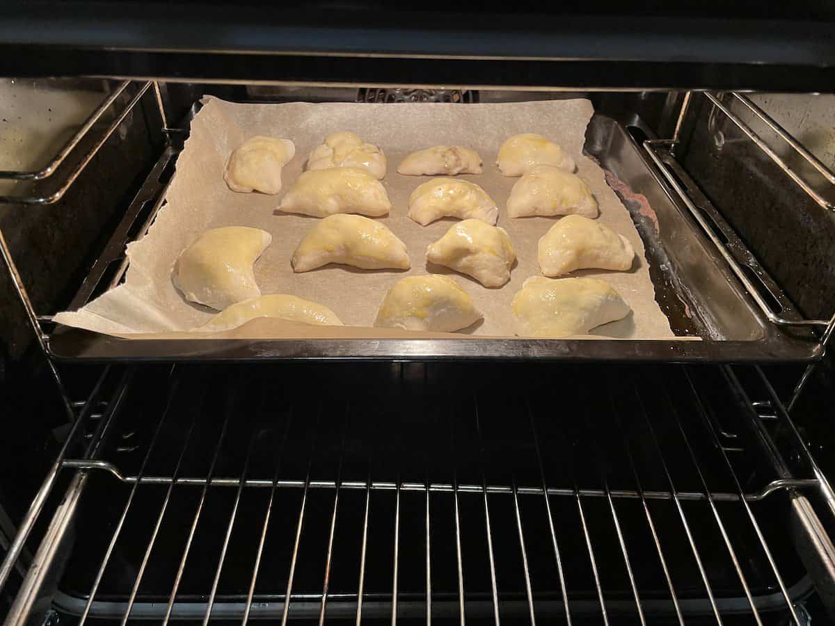 Place the Polish empanada on a parchment lined baking tray.