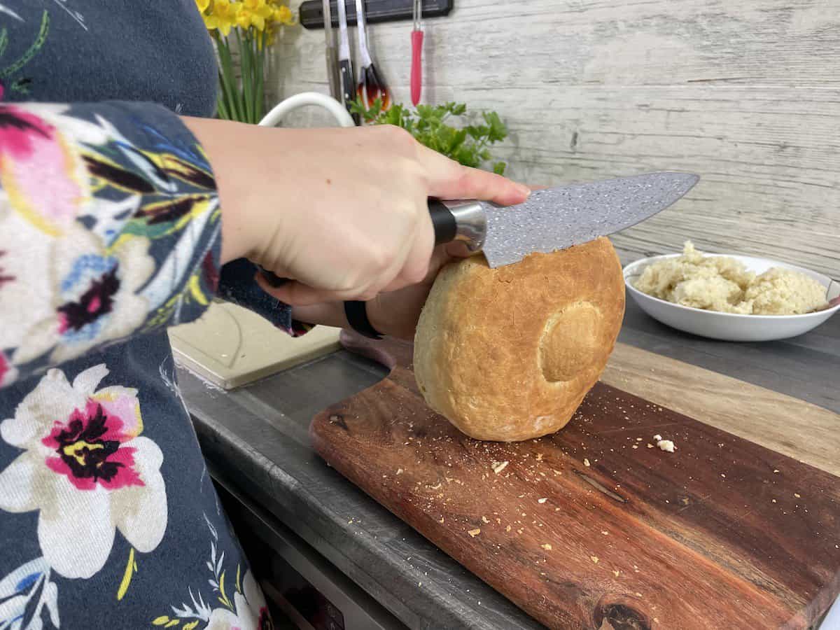 Cut off the top of the Polish bread bowl.