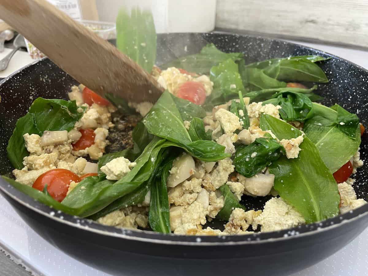 Add tomatoes and spinach