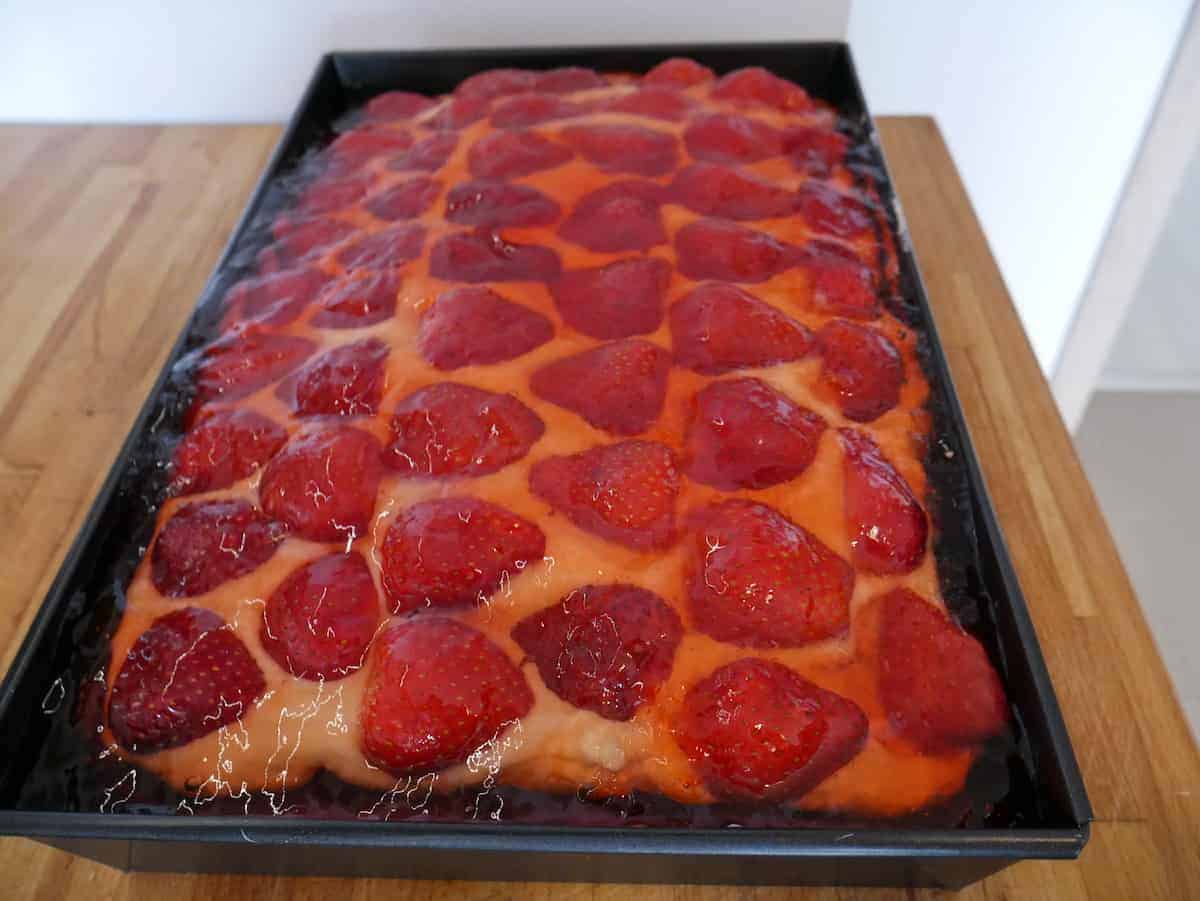 An authentic Polish strawberry tort truskawkowy displayed elegantly on a table.
