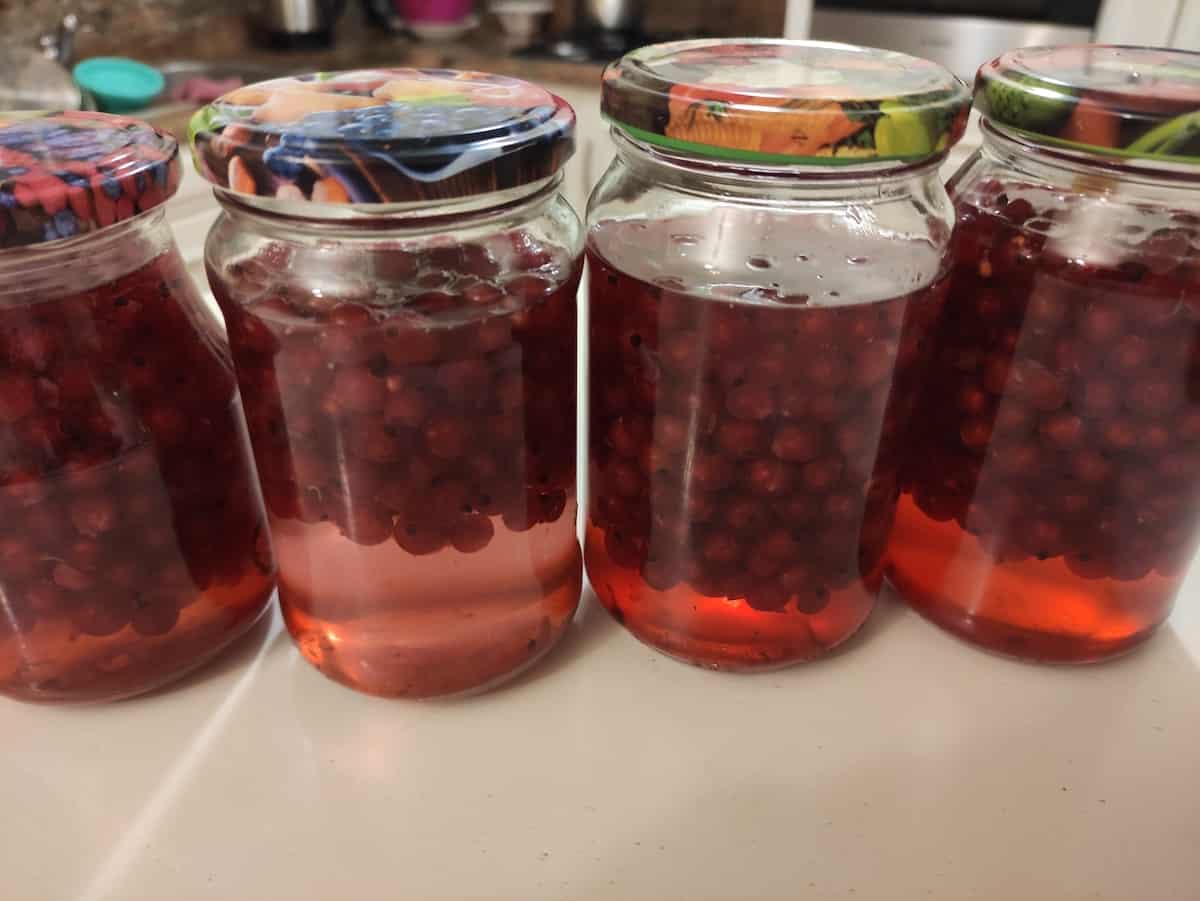 Cherry kompot in glass jars.