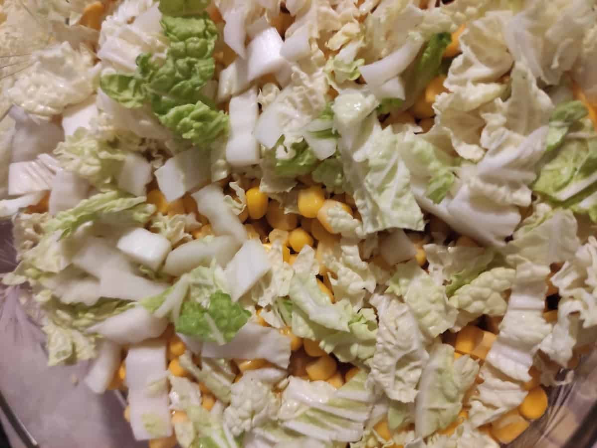 Cabbage on top of corn.