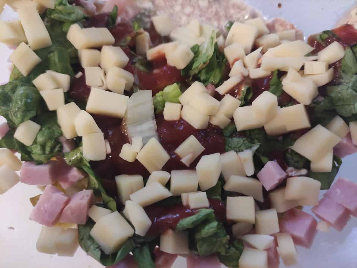 Top view of Polish layered salad with ham.