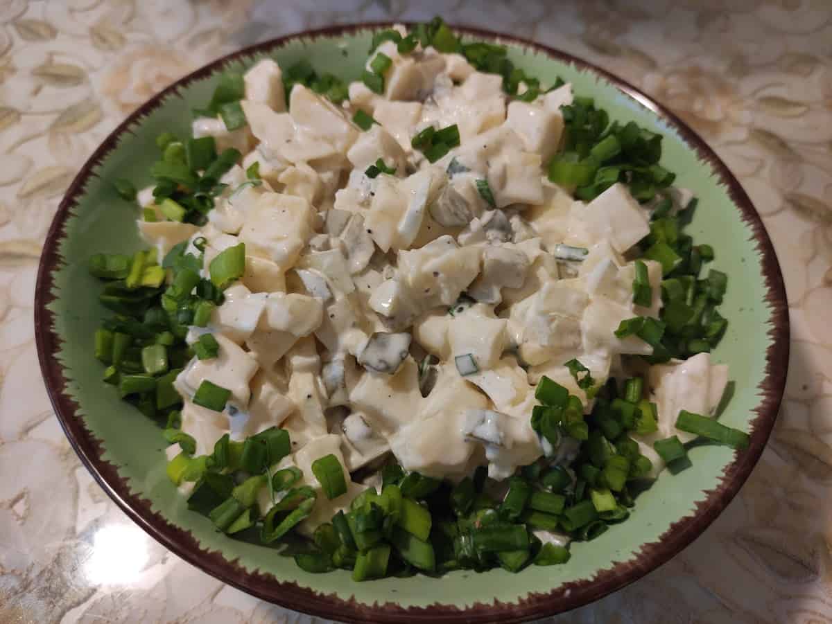 polish potato salad in a green bowl.