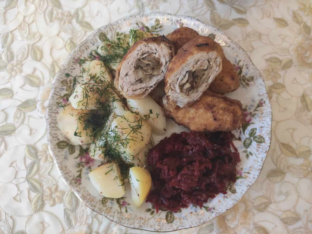 Stuffed pork chops with boiled potatoes and beetroot salad.