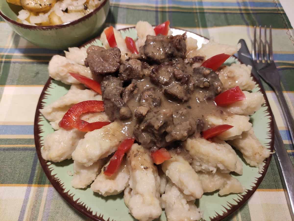 Szare kluchy dumplings with meat and veggies.