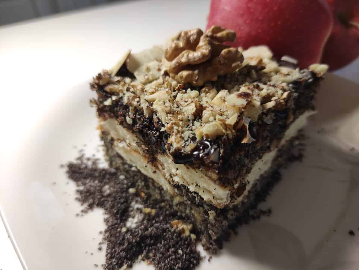 A delicious apple poppy seed cake on a plate.