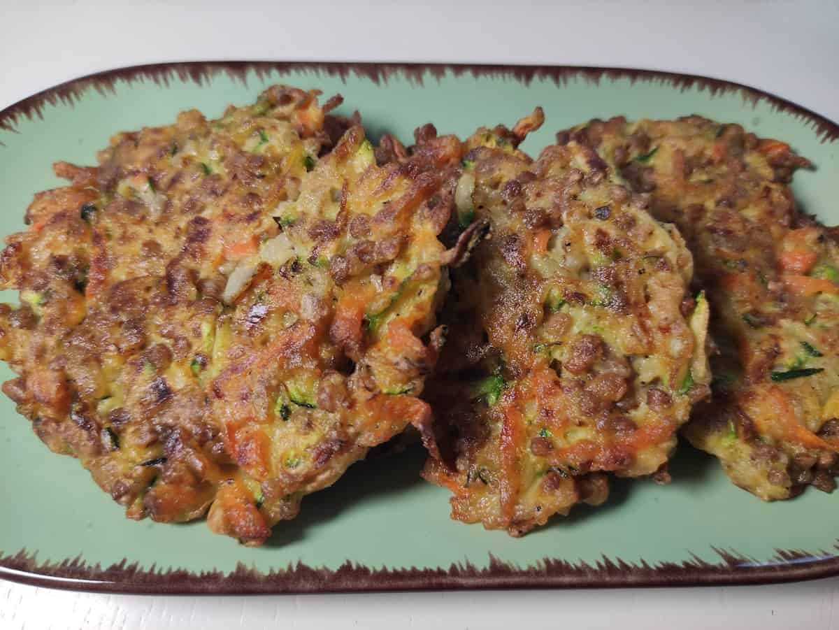 Placki Z Kaszy Gryczanej on a blue plate.